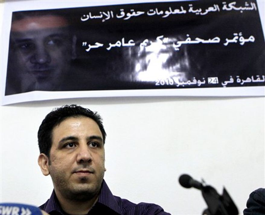 Egyptian Abdel Kareem Nabil, known by his blogging name of Kareem Amer, during a presser following his release, in Cairo, Egypt, Wednesday, Nov. 24, 2010. A recently released Egyptian blogger who served the longest prison term in the Arab world for his writings says jail was a "cruel experience" but his views remain unchanged. Abdel Kareem Nabil, known by his blogging name Kareem Amer, was arrested in March 2006, was convicted of insulting Islam and the president and served four years in prison. He was released on Nov. 16. (AP Photo/Amr Nabil)