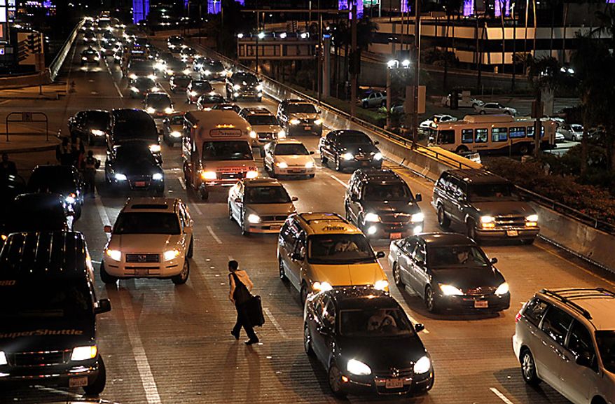 A traveler arrives at Los Angeles International Airport in Los Angeles, Wednesday, Nov. 24, 2010. (AP Photo/Jae C. Hong)