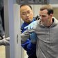** FILE ** Transportation Security Administration (TSA) officer pats down a traveler as he works his way through security at the Minneapolis-St. Paul International Airport in Bloomington, Minn. (AP Photo/Craig Lassig)