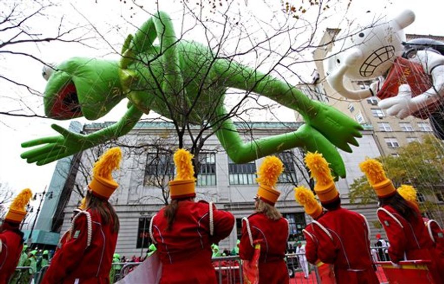 Kermit the Frog and Diary of a Wimpy Kid balloons float in the air before the start of the Macy's Thanksgiving Day Parade in New York Thursday, Nov. 25, 2010. (AP Photo/Craig Ruttle)
