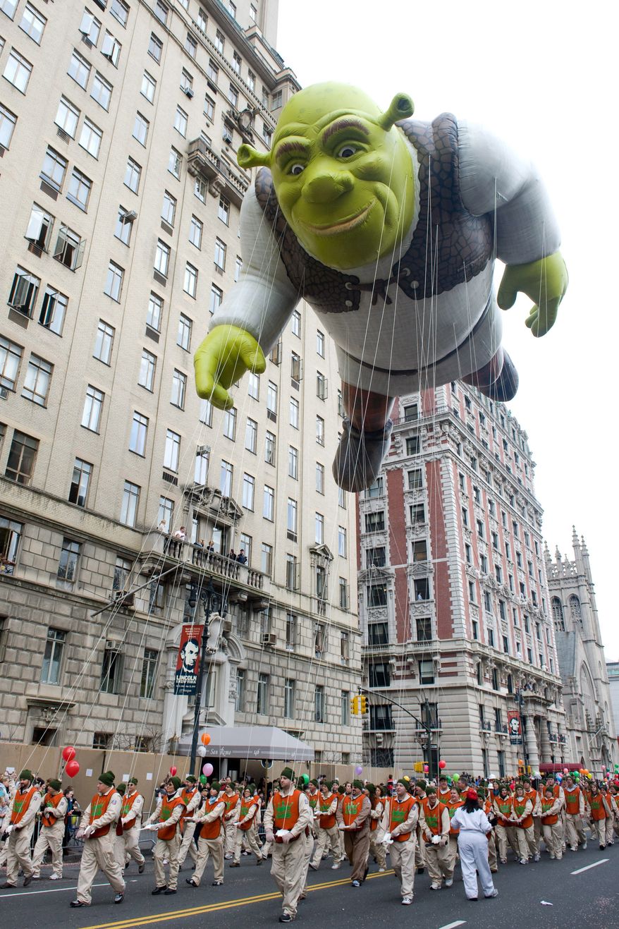 In this Nov. 26, 2009, file photo, the Shrek balloon floats down Central Park West during the Macy's Thanksgiving Day Parade in New York. (AP Photo/Charles Sykes, File)