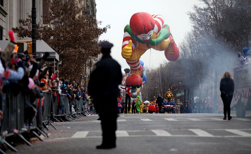 The balloon of character Ronald McDonald floats along Central Park West during the Macy's Thanksgiving Day Parade in New York Thursday, Nov. 25, 2010. (AP Photo/Craig Ruttle)