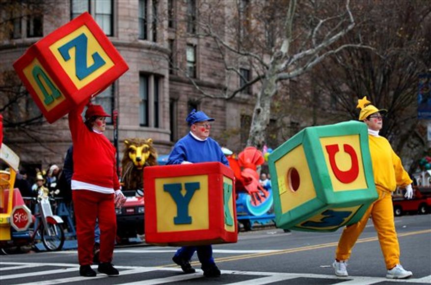 Kylie Monogue rides a float down Central Park West in the Macy's Thanksgiving Day Parade in New York, Thursday, Nov. 25, 2010. (AP Photo/Charles Sykes)
