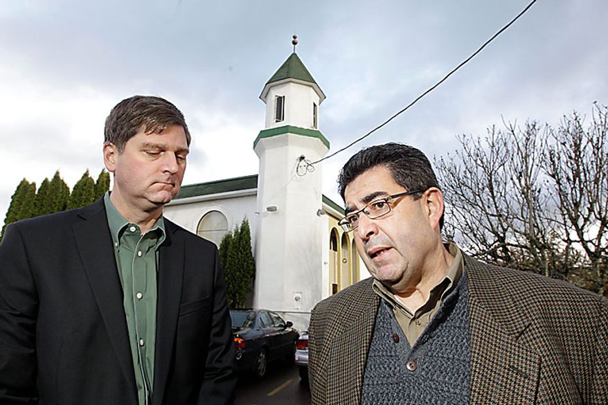 FBI special agent in charge of Oregon Arthur Balizan, right, makes remarks while Dwight Holton, U.S. Attorney for Oregon looks on during a news conference in front of the Salman Al-Farisi Islamic Center in Corvallis, Ore. Sunday, Nov. 28, 2010, where an alleged arsonist set a fire in the early morning hours. Anger on Sunday over a Somali-born teen's failed plan to blow up a van full of explosives during Portland's Christmas tree lighting ceremony apparently erupted in arson on Sunday when a fire damaged the Islamic center once frequented by the suspect. Police don't know who started the blaze or exactly why, but they believe the mosque was targeted because terror suspect Mohamed Osman Mohamud, 19, occasionally worshipped there. (AP Photo/Rick Bowmer)