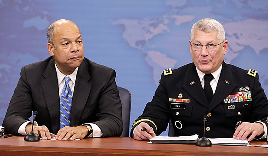 Pentagon General Counsel Jeh Johnson, left, and Army Gen. Carter Ham, speak to reporters on gays in the military, Tuesday, Nov. 30, 2010, at the Pentagon. (AP Photo/Charles Dharapak)