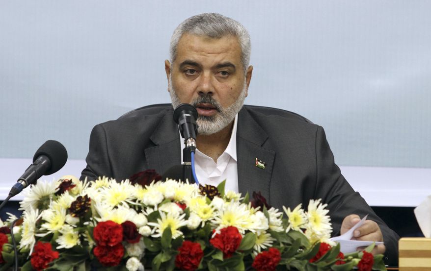 **FILE** Ismail Haniyeh, Gaza's Hamas prime minister, conducts a rare press conference with foreign journalists at his office in Gaza City on Dec. 1, 2010. (Associated Press)