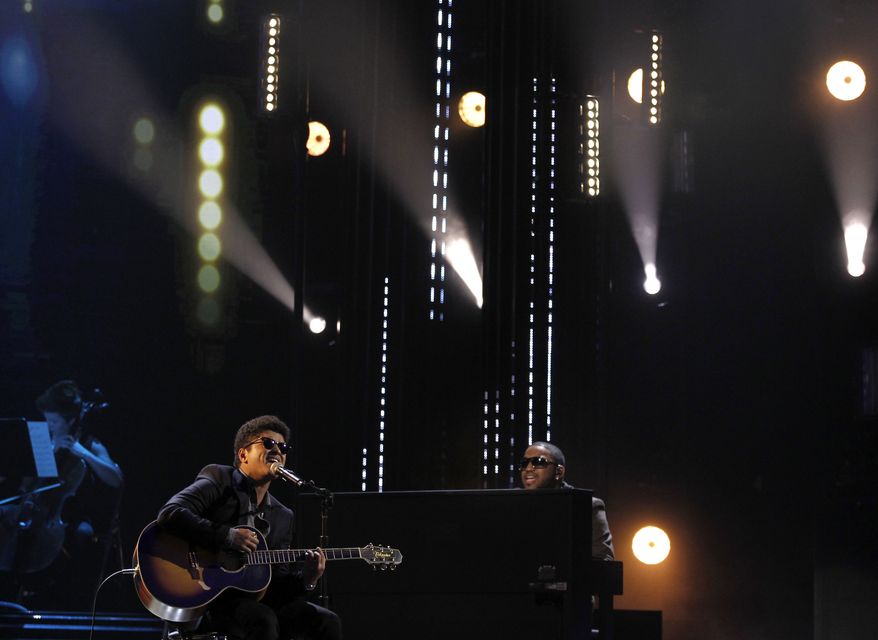Bruno Mars performs "Just the Way You Are" at the Grammy nominations concert on Wednesday, Dec. 1, 2010, in Los Angeles. (AP Photo/Matt Sayles)