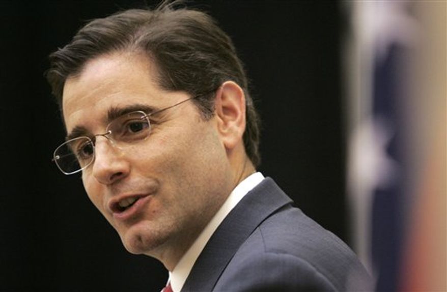 FILE - In this Nov. 24, 2009 file photo, Federal Communications Commission Chairman Julius Genachowski speaks at the University of Arkansas Clinton School of Public Service in Little Rock, Ark. Federal regulators are moving ahead with a plan to prohibit phone and cable companies from blocking or discriminating against Internet traffic flowing over their broadband networks. Genachowski will outline his proposal for so-called "network neutrality" rules in a speech on Wednesday, Dec. 1, 2010. (AP Photo/Danny Johnston, File)