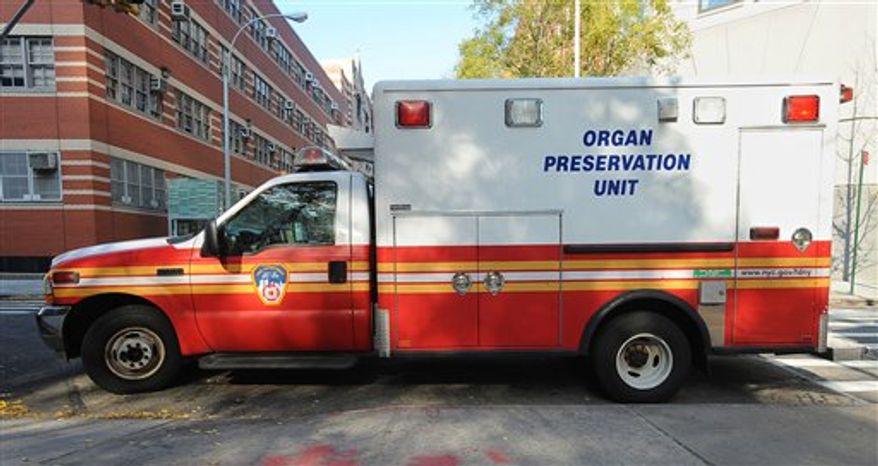 A Nov. 22, 2010 photo released by the New York City Fire Department, shows an Organ Preservation Specialist demonstrating how a donor would be handled inside the FDNY's new Organ Preservation Unit. As part of a new six month pilot program, the vehicle will be staffed with personnel trained to get a donor family's consent, perform medical procedures necessary to keep the donor organ viable, as well as to transport the donor to the hospital so the organs can be harvested for transplant. If someone dies at home, the team will have roughly 20 minutes to start preservation procedures. (AP Photo/FDNY)