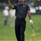Tiger Woods reacts to his tee shot on the third hole during the second round of the Chevron World Challenge golf tournament at Sherwood Country Club on Friday, Dec. 3, 2010, in Thousand Oaks, Calif. (AP Photo/Mark J. Terrill)