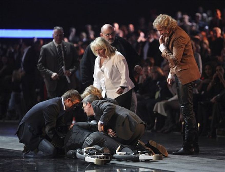 Contestant Samuel Koch, wearing spring shoes, attempts to jumps over a moving car, driven by his father, during the live broadcast of 'Wetten dass ?' (Bet it?), a top show of German TV channel ZDF in Duesseldorf, western Germany, Saturday Dec. 4, 2010. Koch failed during his attempt, crashed to the floor and was taken to a hospital. The show was immediately stopped. Further circumstances and what injuries Koch suffered are unknown at the moment. (AP Photo/ Hermann J. Knippertz/Pool)
