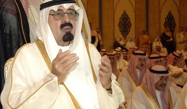 ** FILE ** Saudi Arabia&#x27;s King Abdullah performs Eid al-Fitr prayers to mark the end of the holy fasting month of Ramadan in Mecca, Saudi Arabia, in September 2010.  (AP Photo/Saudi Press Agency)