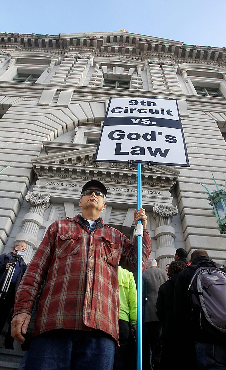 Nils Nelson holds up a sign in favor of Proposition 8 outside of the courthouse before a hearing in the Ninth Circuit Court of Appeals, Monday, Dec. 6, 2010, in San Francisco. The federal appeals court in San Francisco began to hear arguments Monday about the voter-approved ban known as Proposition 8. A trial court judge overturned the measure as a violation of gay Californians' civil rights in August. (AP Photo/Jeff Chiu)