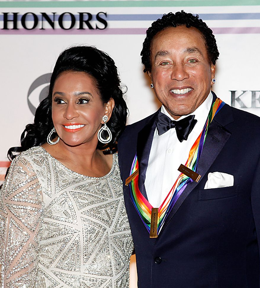 Frances Gladney, left, and husband Smokey Robinson pose on the red carpet at the Kennedy Center Honors in Washington on Sunday, Dec. 5, 2010. (AP Photo/Jacquelyn Martin)