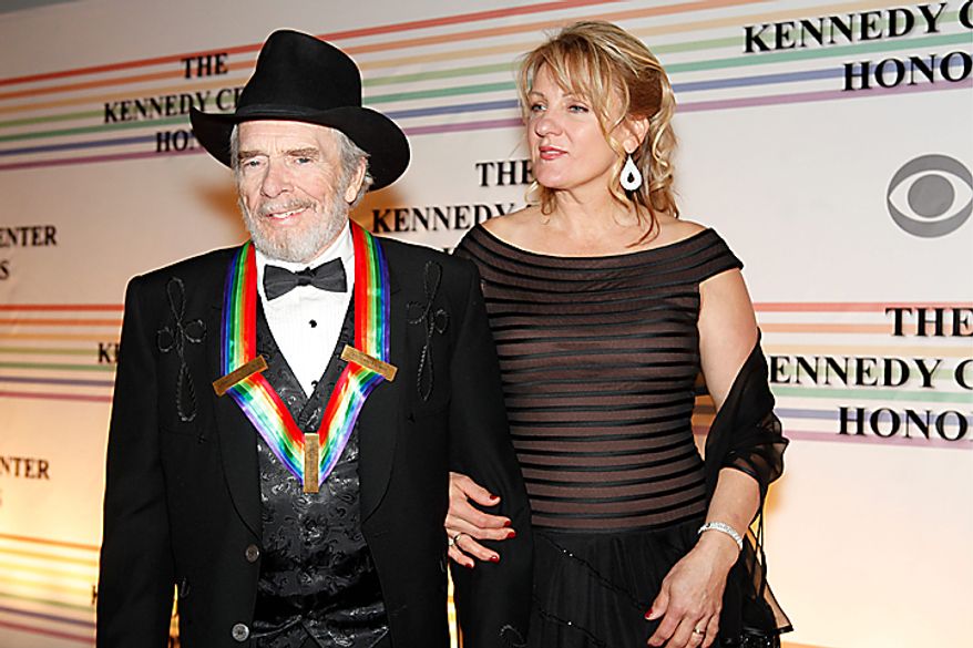 Merle Haggard and Theresa Ann Lane walk the red carpet at the Kennedy Center Honors in Washington on Sunday, Dec. 5, 2010. Mr. Haggard joined fellow honorees Jerry Herman, Bill T. Jones, Paul McCartney and Oprah Winfrey. (AP Photo/Jacquelyn Martin)