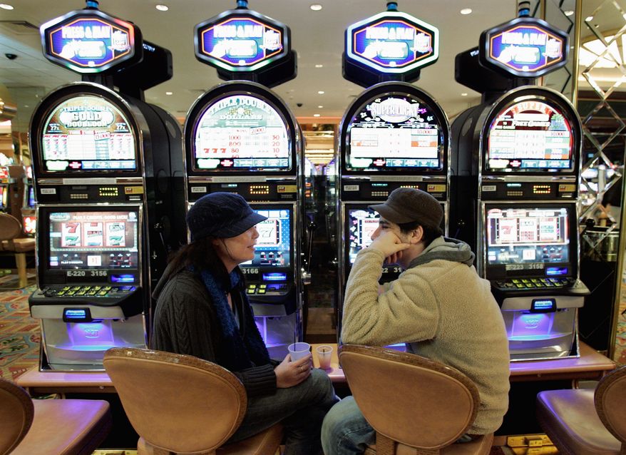 Nicole Kerrys and Joe Nicoba talk at Atlantic City's Tropicana Casino in February. A study documents drops in the number of casino patrons and the money each spends. (Associated Press)