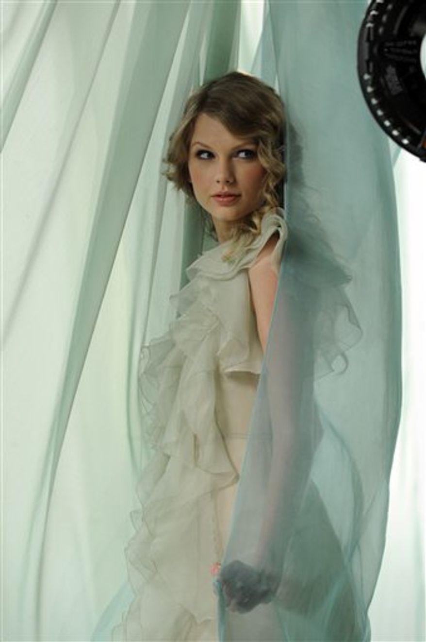 This undated photo courtesy of CoverGirl shows Taylor Swift during the CoverGirl NatureLuxe ad shoot. In her new CoverGirl ads debuting this week, Swift has a more ethereal vibe. (AP Photo/CoverGirl) NO SALES