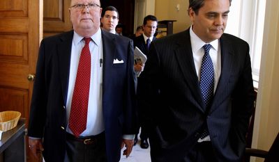 U.S. District Judge G. Thomas Porteous (left) walks with his attorney, Jonathan Turley, on Capitol Hill on Wednesday after the Senate voted on his impeachment. He was removed from the bench. (Associated Press)