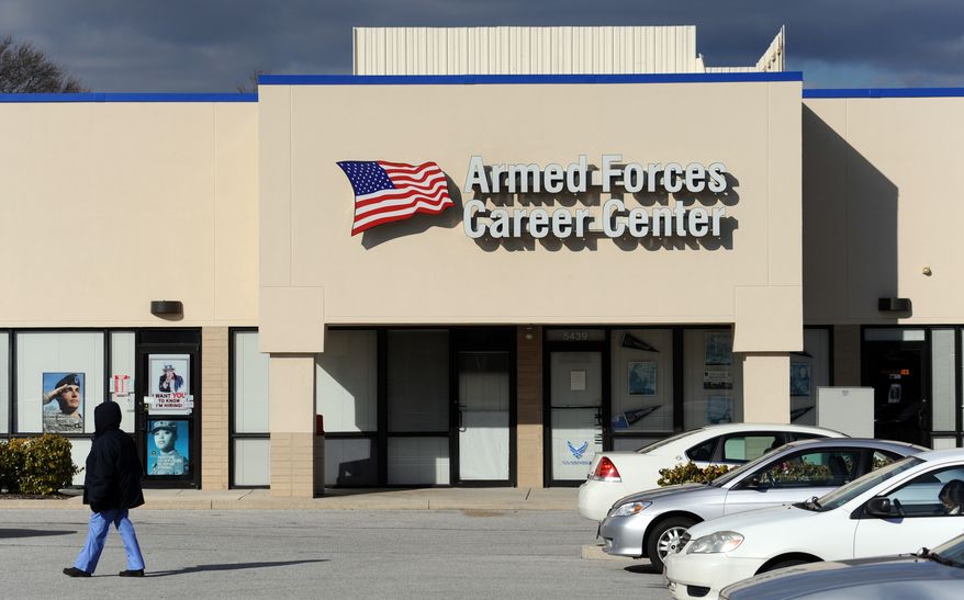 A woman walks past an Armed Forces Career Center in Catonsville, Md., on Wednesday, Dec. 8, 2010. Antonio Martinez, also known as Muhammad Hussain, faces charges of attempted murder and attempted use of a weapon of mass destruction after he allegedly tried to detonate what he thought was a bomb at the center, authorities said. (AP Photo/Steve Ruark)