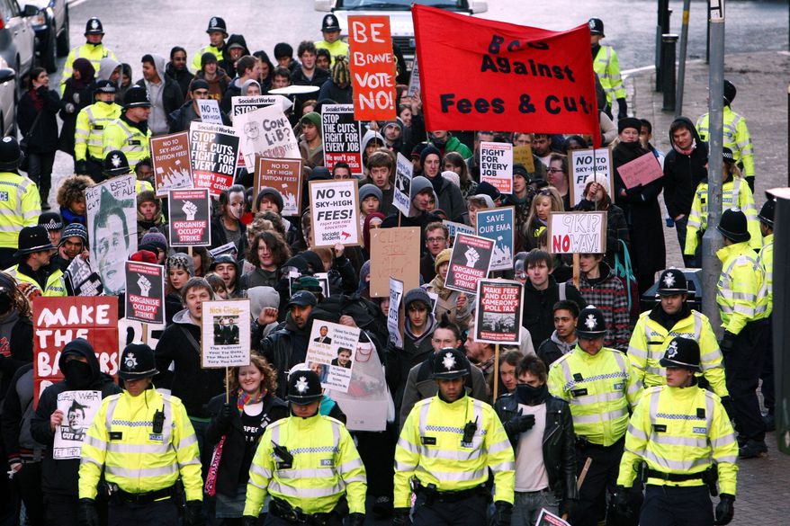 Students march through Birmingham, England, in protest at the increase in student fees Wednesday Dec. 8, 2010. (AP Photo/David Jones/PA Wire)