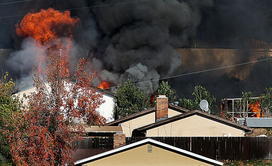 A house erupts in flames on Thursday, Dec. 9, 2010 during the controlled burn of a home in Escondido, Calif., that was so packed with homemade explosives that authorities claim they had no choice but to burn it to the ground. The house was rented by an out-of-work software consultant who allegedly assembled an astonishing quantity of bomb-making materials that included chemicals used by Middle Eastern suicide bombers. (AP Photo/Sandy Huffaker, Pool)