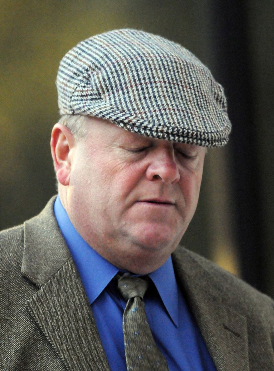 ** FILE ** In this Dec. 6, 2010, file photo, New Orleans police Officer Gregory McRae enters federal court in New Orleans. A jury on Thursday, Dec. 9, 2010, convicted McRae of burning the body of 31-year-old Henry Glover after he was shot dead by police in the aftermath of Hurricane Katrina. (AP Photo/Cheryl Gerber, File)