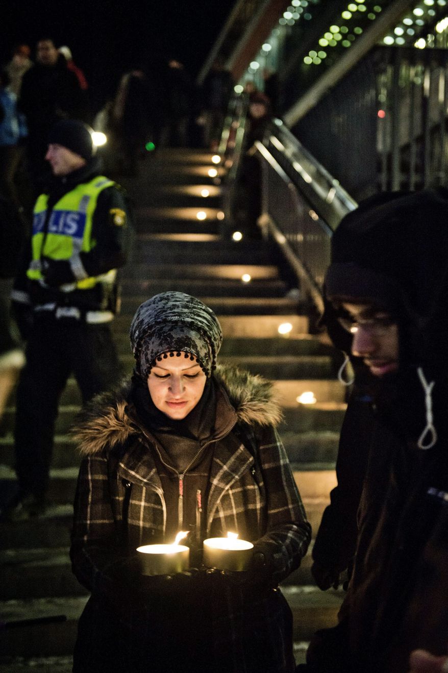 Sama Sarsour, with Swedish Muslims for Peace and Justice, demonstrates for peace in Stockholm on Sunday. Swedish police said two blasts Saturday in the city were terrorism. (Associated Press)