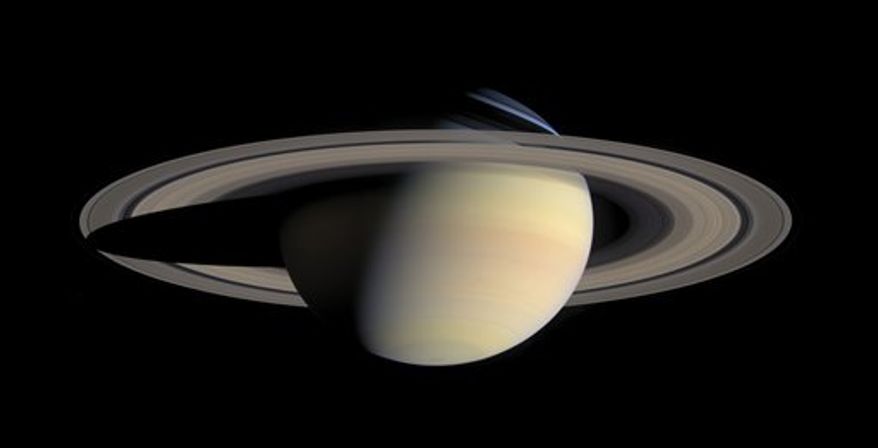 This image provided by NASA, taken Oct. 6, 2004, by the Cassini Saturn Probe, shows the planet Saturn and its rings. One of the most evocative mysteries of the solar system, where Saturn got its stunning rings, may actually be a case of cosmic murder with an unnamed moon of Saturn, that disappeared about 4.5 billion years ago, as the potential victim. Suspicion has fallen on a disk of hydrogen gas, that surrounded Saturn when its dozens of moons were forming, but has now fled the scene. And the cause of death? A possible forced plunge into Saturn. (AP Photo/NASA)