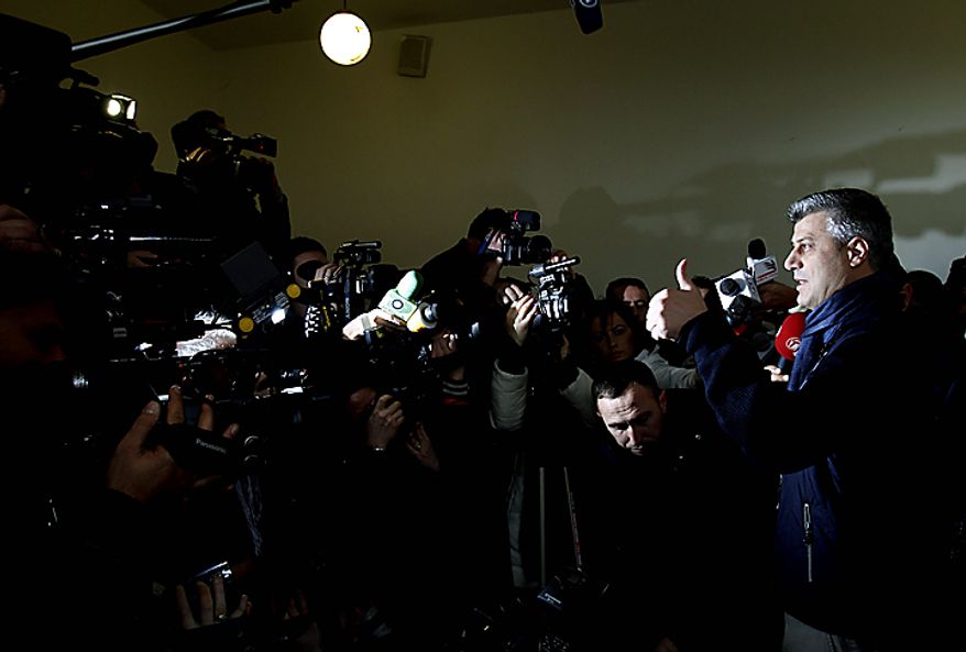 Leader of Democratic Party of Kosovo (PDK) Hashim Thaci, gestures, after casting his ballot during the general elections, in Kosovo capital Pristina on Sunday, Dec. 12, 2010. Kosovars vote in the first general poll since the country's declaration of independence from Serbia in 2008, a critical election already marred by ethnic tension that many fear will split the world's newest country. Some 1.6 million voters are eligible to vote for 29 political parties, coalitions and citizens' initiatives to enter Kosovo's 120-seat parliament. (AP Photo/Visar Kryeziu)