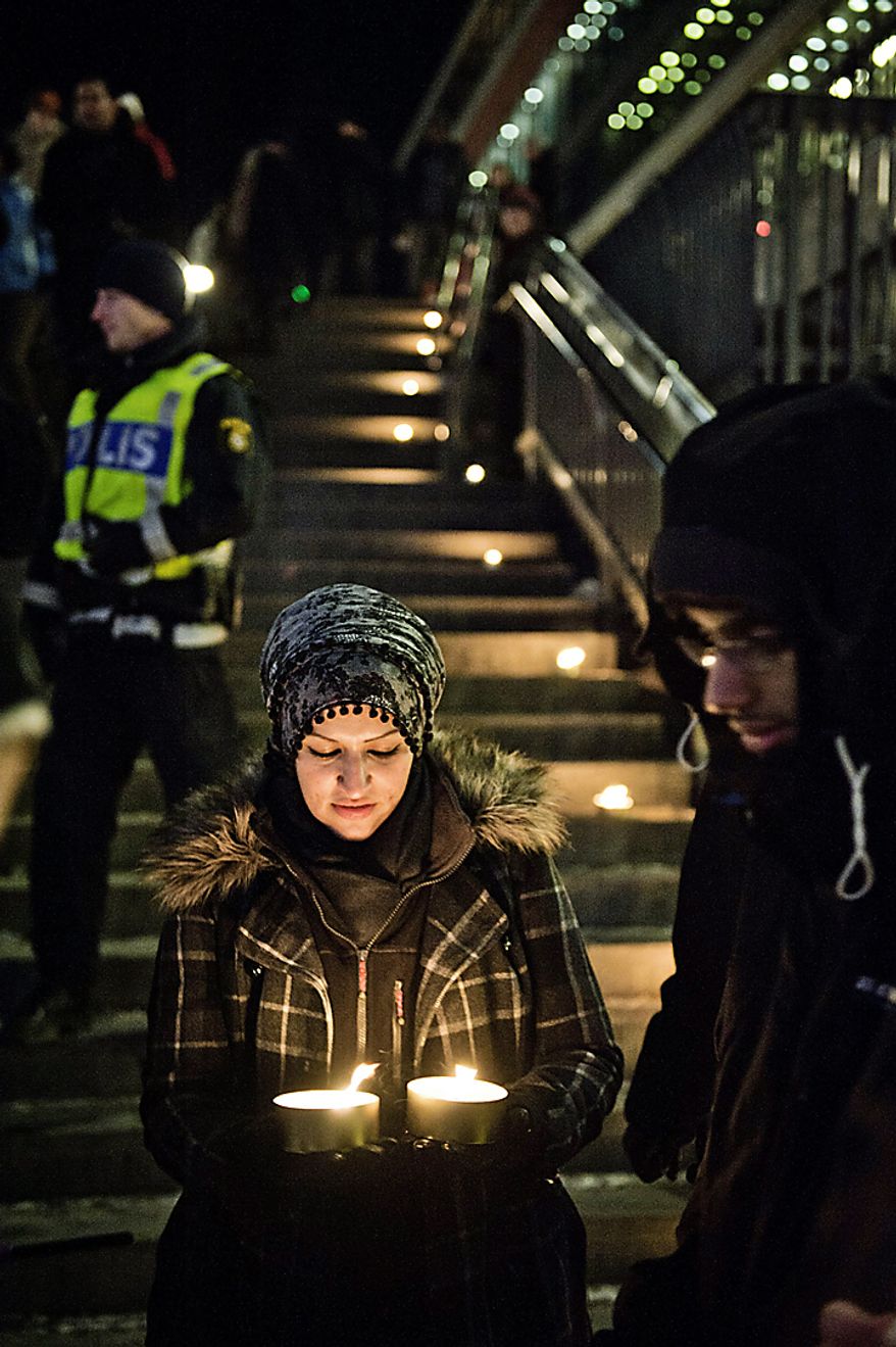 Sama Sarsour from Swedish Muslims for Peace and Justice (SMFR) participates in a peace demonstration at Sergels square in central Stockholm Sunday Dec. 12, 2010 . Swedish police said Sunday that two explosions in central Stockholm were an act of terrorism, in what appeared to be the first attack in the Nordic country by a suicide bomber. The suspect, who was not named, killed himself and injured two people on a busy shopping street Saturday. (AP photo/Scanpix Sweden/Marc Femenia)