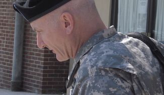 ** FILE ** Army Lt. Col. Terrence Lakin leaves the military courthouse at Fort Meade, Md., on Sept. 2, 2010. (AP Photo/David Dishneau, File)