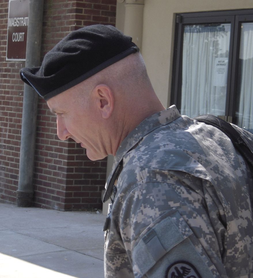 ** FILE ** Army Lt. Col. Terrence Lakin leaves the military courthouse at Fort Meade, Md., on Sept. 2, 2010. (AP Photo/David Dishneau, File)