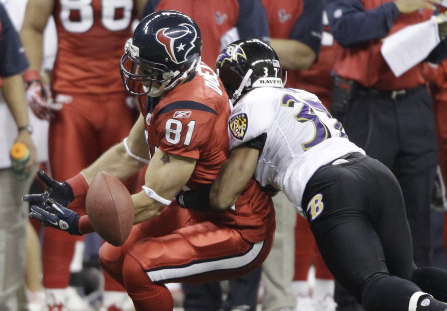 Houston Texans tight end Owen Daniels (81) misses a catch with help from Baltimore Ravens defensive back Josh Wilson (37) during the first quarter of an NFL football game Monday, Dec. 13, 2010, in Houston. (AP Photo/David J. Phillip)