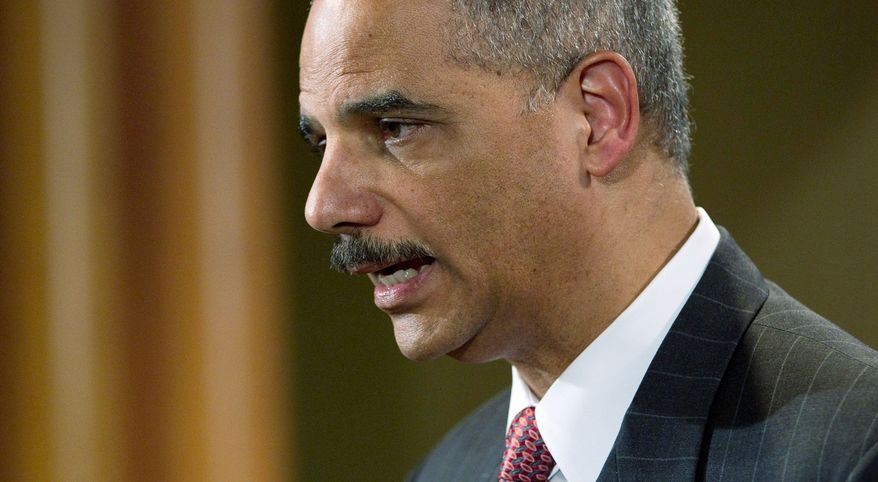ASSOCIATED PRESS
SPILL SALVO: Attorney General Eric H. Holder Jr. announces a lawsuit against BP PLC on Wednesday. The Justice Department accuses the company of failing to take proper safety precautions.