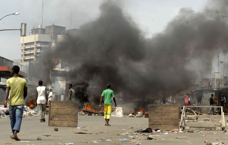 Supporters of longtime Ivorian opposition leader Alassane Ouattara -- whose presidential election victory has been acknowledged by the United Nations, the United States, France and the African Union -- take to the streets in Abidjan, Ivory Coast, on Thursday, Dec. 16, 2010. (AP Photo/Emanuel Ekra)