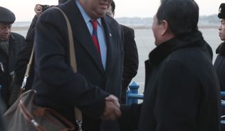 ** FILE ** Then-New Mexico Gov. Bill Richardson (left) is greeted by Li Gun of the North Korean Foreign Ministry&#39;s American Affairs Department upon arriving at the Pyongyang airport on Thursday, Dec. 16, 2010. (AP Photo/APTN)