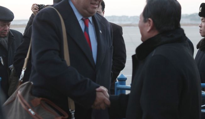 ** FILE ** Then-New Mexico Gov. Bill Richardson (left) is greeted by Li Gun of the North Korean Foreign Ministry&#x27;s American Affairs Department upon arriving at the Pyongyang airport on Thursday, Dec. 16, 2010. (AP Photo/APTN)