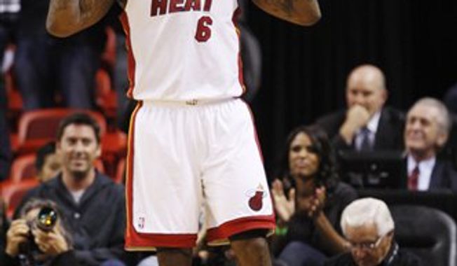 Cleveland Cavaliers&#x27; Daniel Gibson (1) tries to steal the ball from Miami Heat&#x27;s LeBron James (6) during the second half of an NBA basketball game in Miami, Wednesday, Dec. 15, 2010. The Heat won 101-95. (AP Photo)