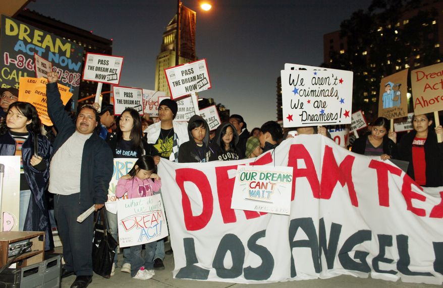 Immigrant parents, students and others participate in a candle-light procession and vigil in support of the Federal Dream Act in downtown Los Angeles on Dec. 7, 2010. The Senate on Saturday, Dec. 18, 2010, blocked the bill that would have granted legal status to hundreds of thousands of illegal immigrant children and young adults.(AP Photo/Damian Dovarganes)