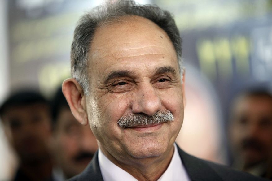 Sunni lawmaker Saleh al-Mutlaq speaks to reporters in Baghdad on Feb. 25, 2010. Iraq's parliament on Saturday, Dec. 18, 2010, lifted a ban on Mr. al-Mutlaq and two other Sunnis Muslim politicians. (AP Photo/Hadi Mizban, File)