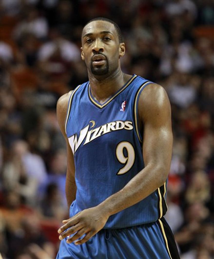 FILE - This Nov. 29, 2010, file photo shows Washington Wizards' Gilbert Arenas during an NBA basketball game against the Miami Heat, in Miami. A person familiar with the situation says the Orlando Magic have traded for Arenas, and Hedo Turkoglu and Jason Richardson of the Phoenix Suns. Orlando will send forward Rashard Lewis to Washington and guards Vince Carter and Mickael Pietrus to Phoenix, the person told The Associated Press on condition of anonymity because the deals were still being finalized. (AP Photo/Alan Diaz, File)