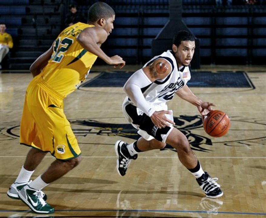This Nov. 12, 2010 photo released by Long Island University shows Julian Boyd shooting a jumper against Norfolk State.It was Boyd's first game back since March 2009 when he was told he had a heart condition known as noncompaction cardiomyopathy, part of his heart was enlarged. (AP Photo/Long Island University, Mike McLaughlin)