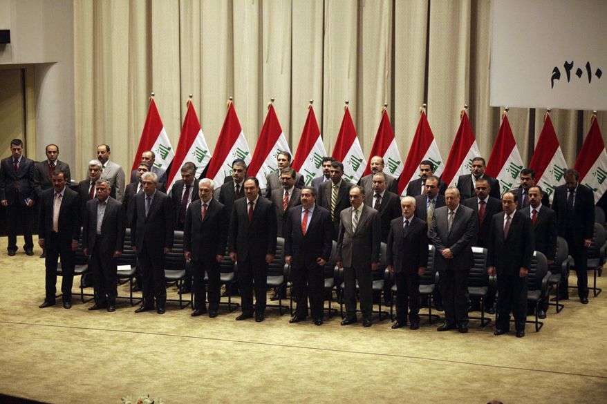 The new Iraqi government is pictured at a swearing-in ceremony in Baghdad on Tuesday, Dec. 21, 2010. Iraqi lawmakers unanimously approved the new government, which will be headed by incumbent Shi&#39;ite Prime Minister Nouri al-Maliki (bottom right). The installation of the officials ends nine months of political deadlock that threatened to stall economic development and suck the country back into sectarian violence. (AP Photo/Karim Kadim)
