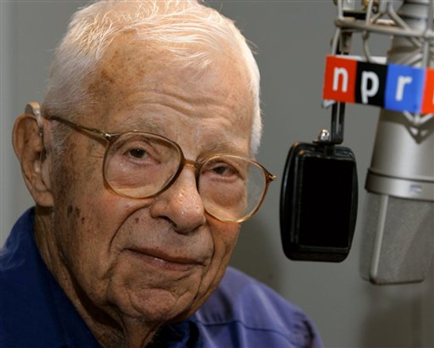 FILE - In this Oct. 3, 2005 file photo, veteran reporter and commentator Daniel Schorr sits at the microphone in the studios of National Public Radio in Washington. Newly released FBI files depict the Nixon White House role in ordering an investigation into newsman Schorr, whose tough reporting got him on the president's infamous enemies list. (AP Photo/J. Scott Applewhite, File)
