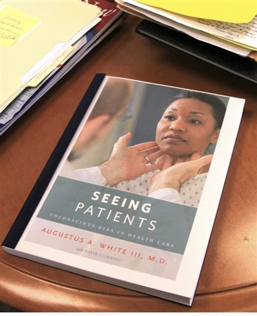 In this Dec. 21, 2010 photo, a proof copy of the book, "Seeing Patients," rests on Harvard Medical School professor Augustus White's desk in Boston. White's memoir calls for more diversity in the medical field and an end to health care disparities. (AP Photo/Chitose Suzuki)