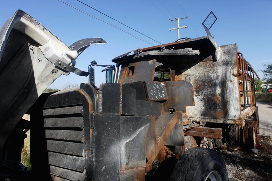 "The Monster," a gravel truck the Zetas converted into a steel-clad tank but the Gulf Cartel destroyed, sits outside Ciudad Mier.