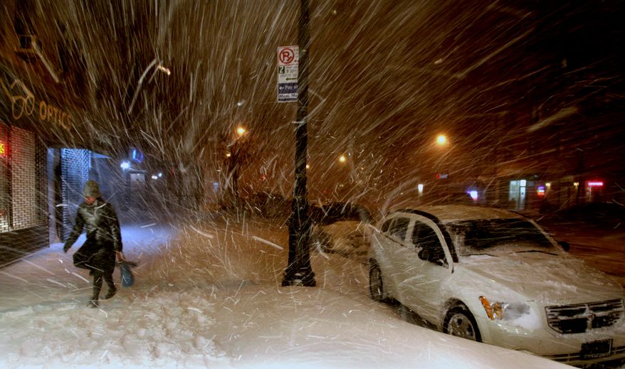 A woman walks along 72nd Street in New York on Sunday, Dec. 26, 2010, in the midst of a blizzard that hammered New York and much of the Northeast. (AP Photo/Craig Ruttle)