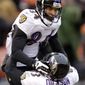 Baltimore Ravens wide receiver T.J. Houshmandzadeh, top, celebrates his 15-yard touchdown catch against the Cleveland Browns with tight end Ed Dickson in the second quarter of an NFL football game Sunday, Dec. 26, 2010, in Cleveland. (AP Photo/Tony Dejak)