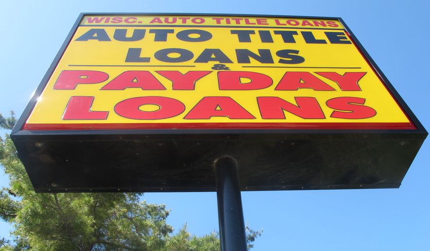 The federal Consumer Financial Protection Bureau is trying to adopt a new rule that could put 70 percent of payday lenders out of business. (AP Photo/Ryan J. Foley)