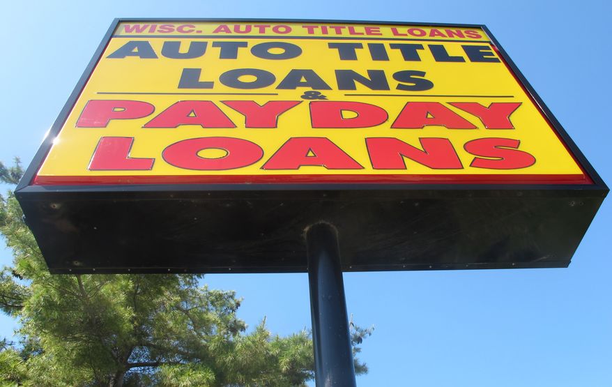 The federal Consumer Financial Protection Bureau is trying to adopt a new rule that could put 70 percent of payday lenders out of business. (AP Photo/Ryan J. Foley)